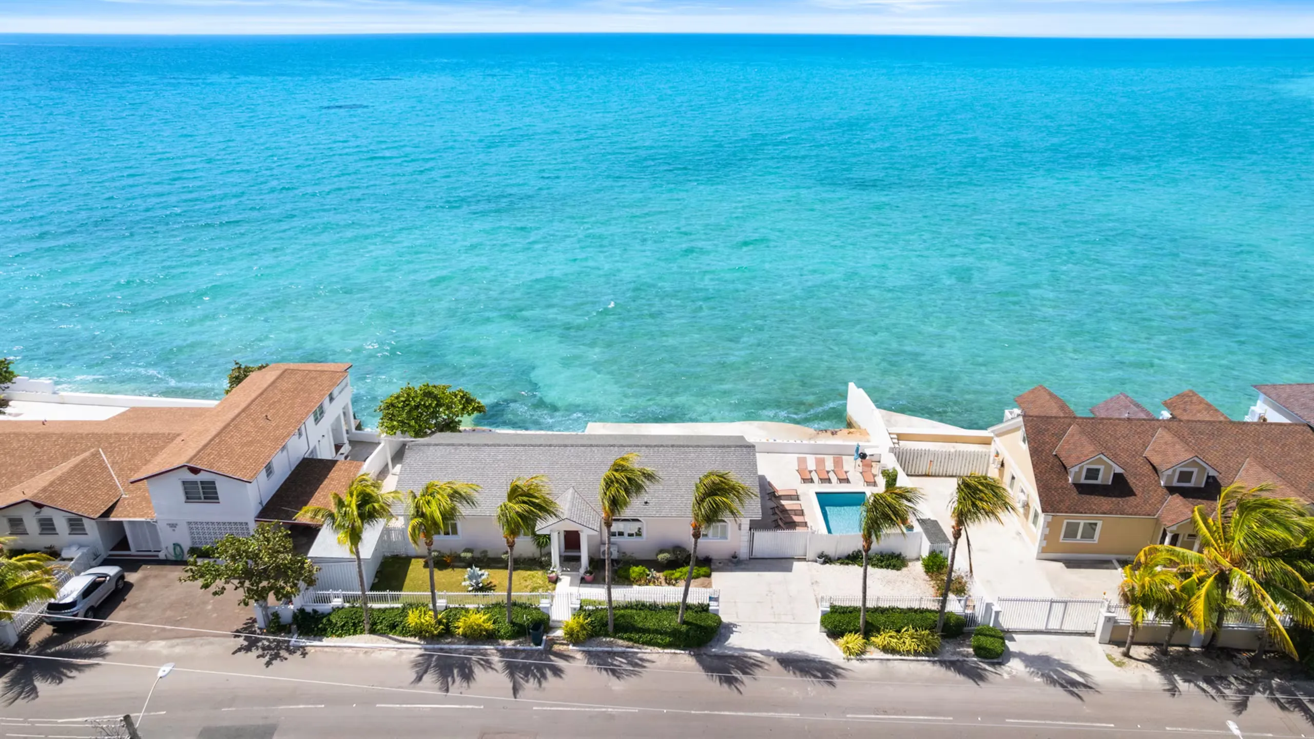 Aerial view of the villa along the coastline
