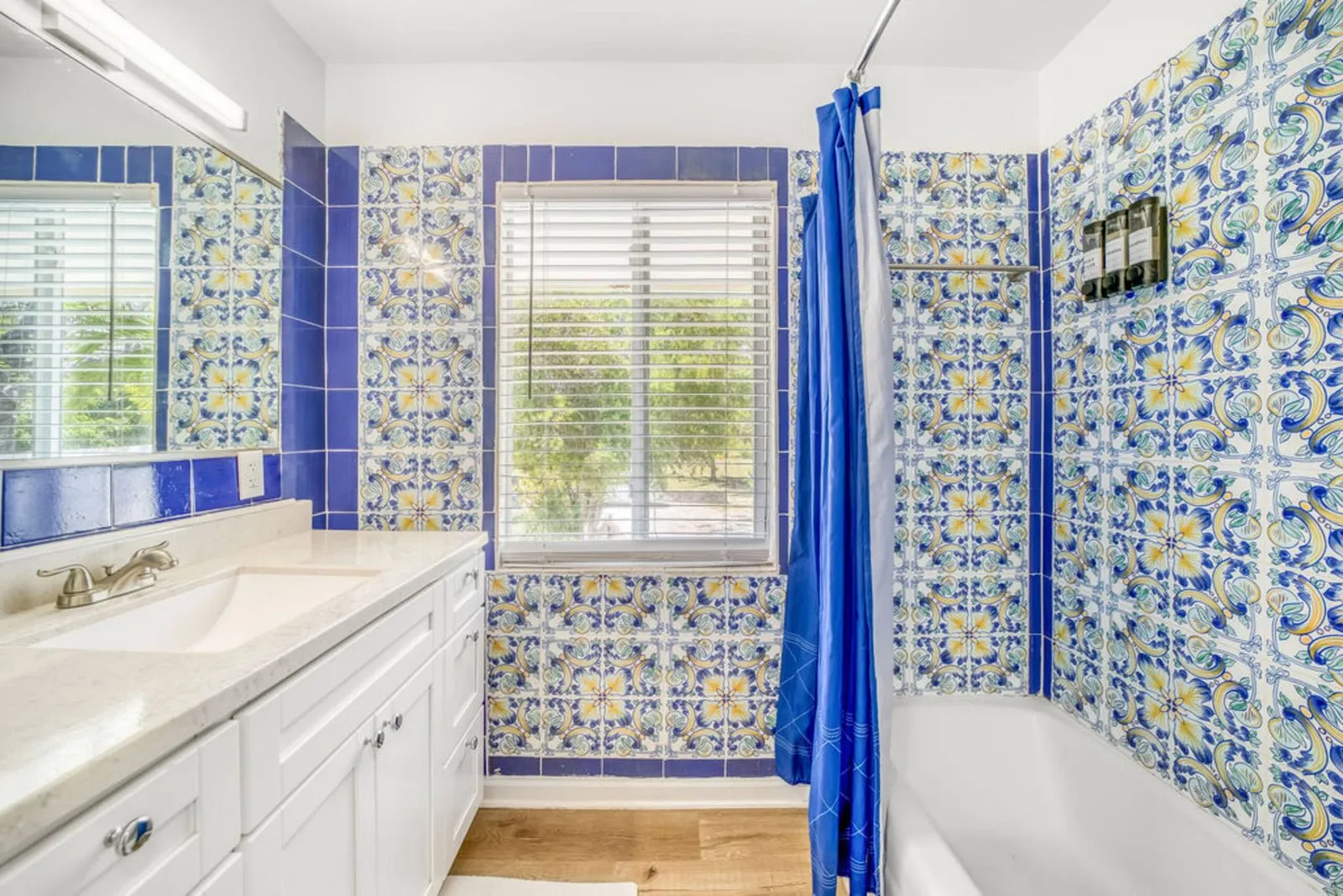 Bathroom with blue Mediterranean-pattern tile