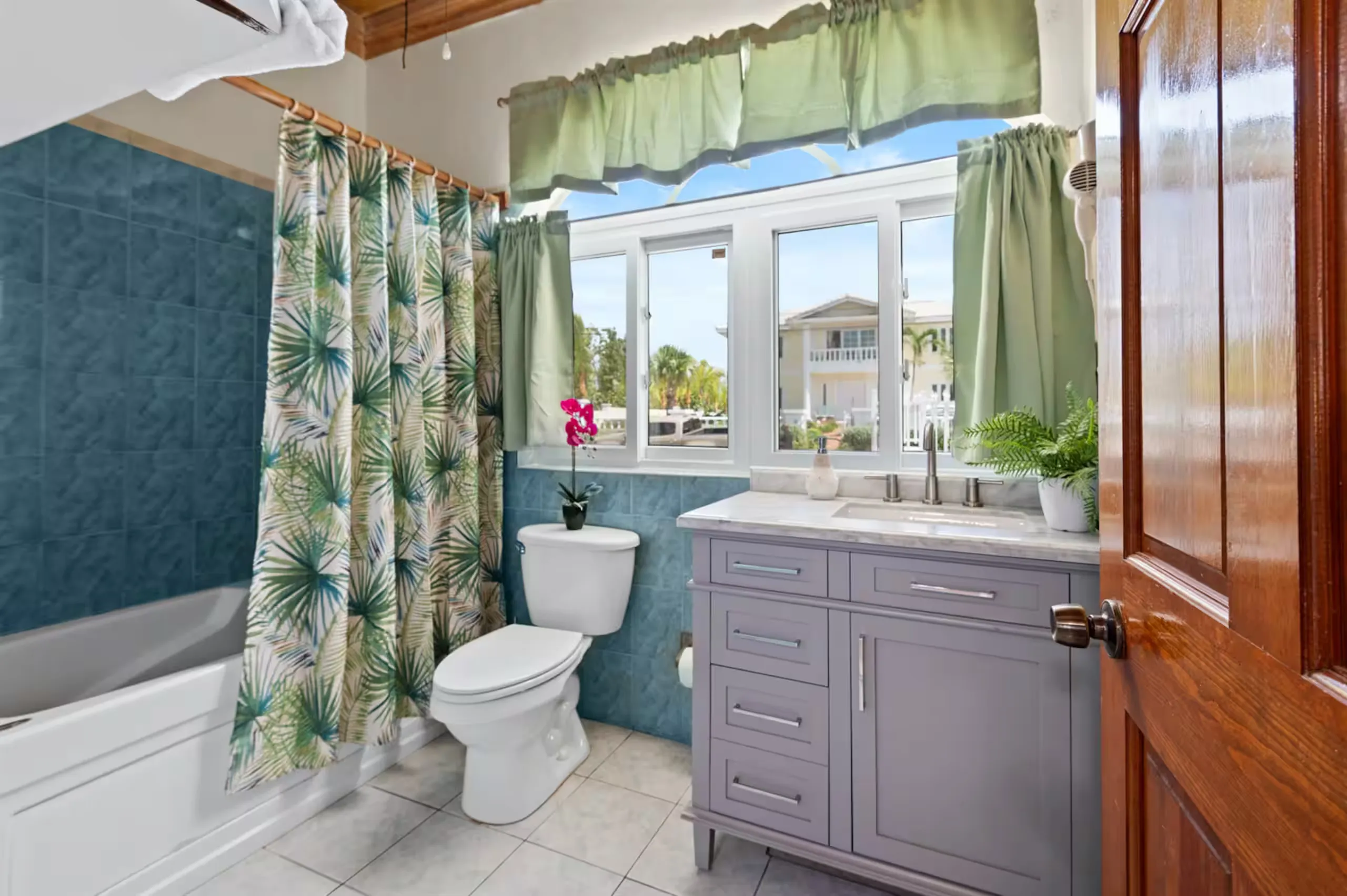 Bathroom with a tub-shower and vanity