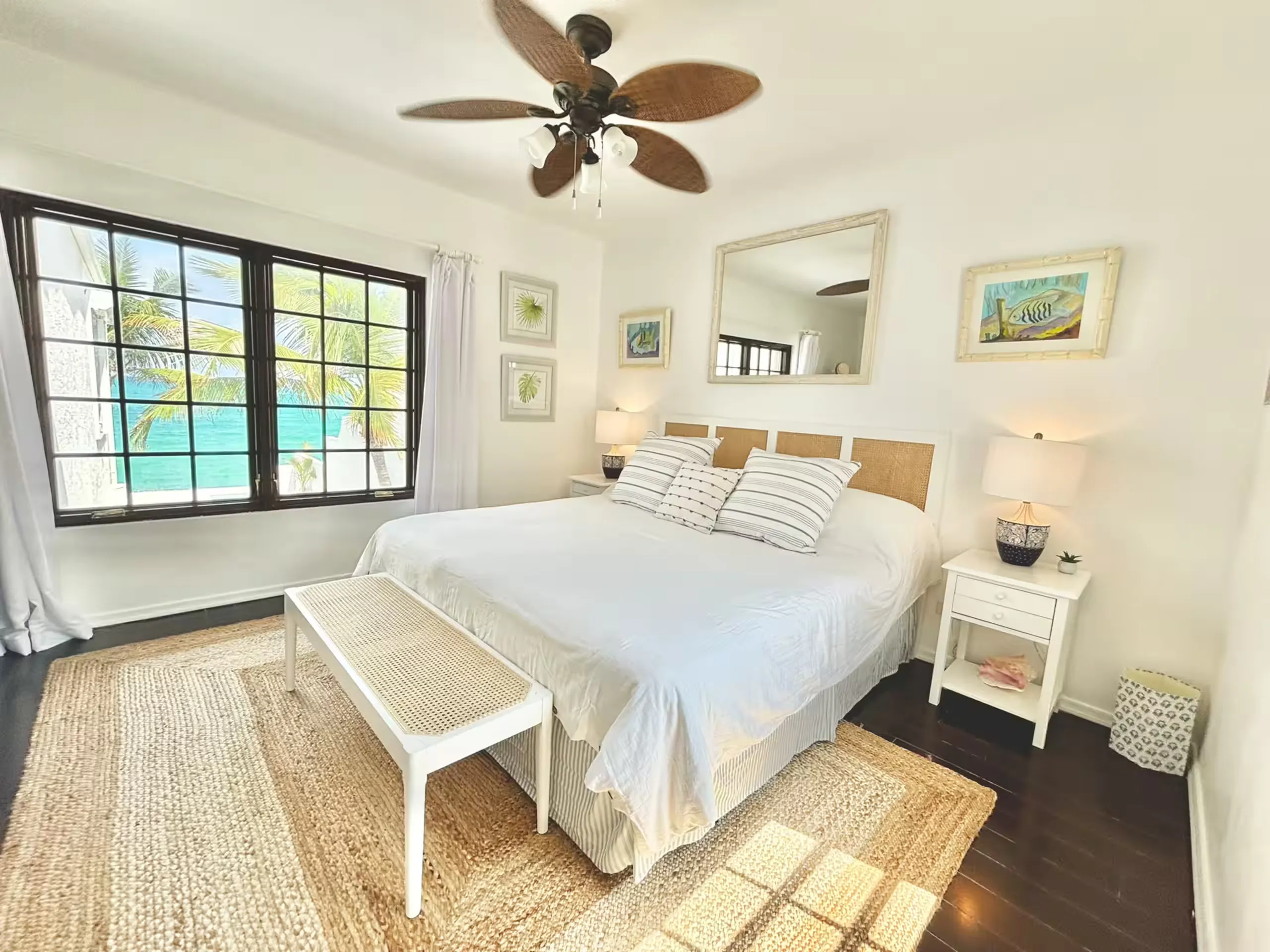 Bedroom with ocean view through a large grid window