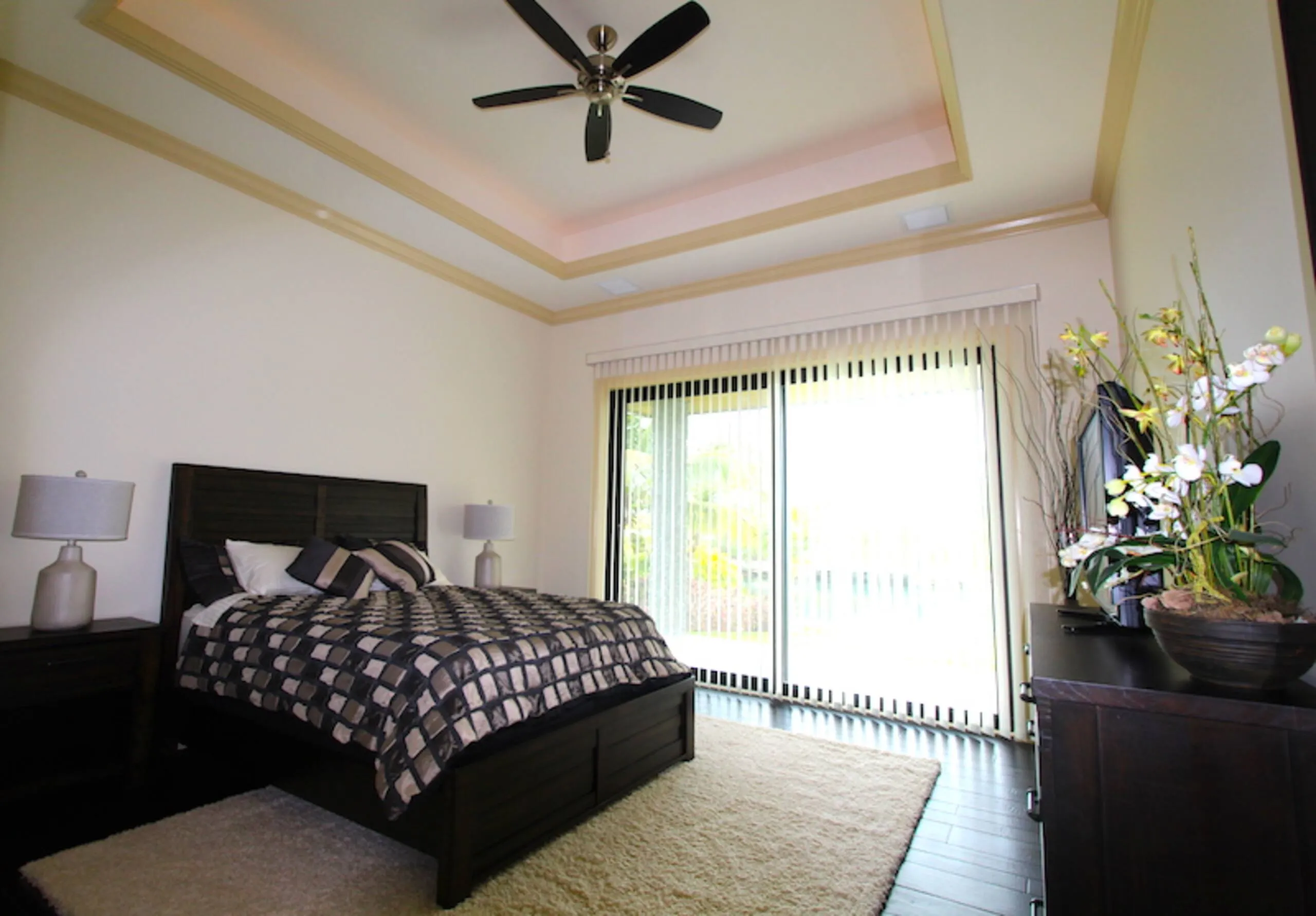 A second bedroom suite with matching dark wood furniture