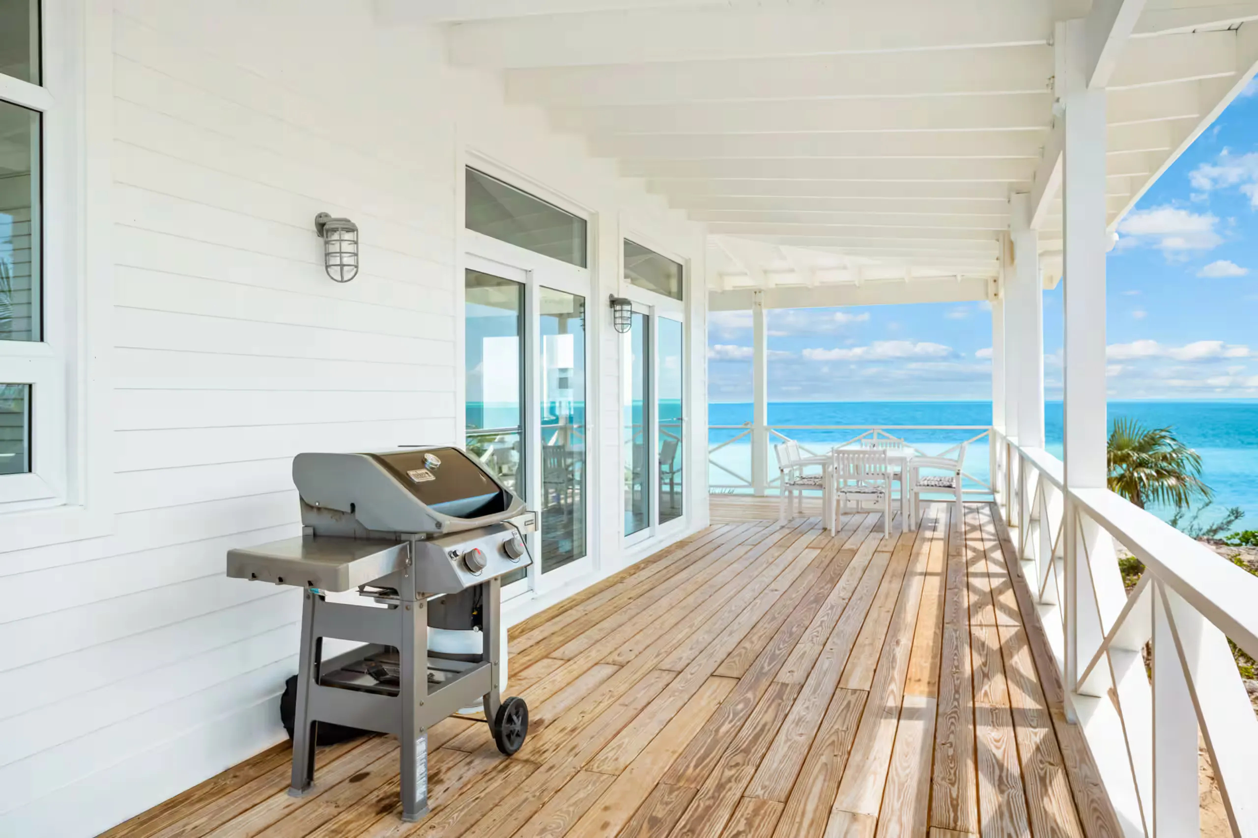 Deck with a grill and ocean view