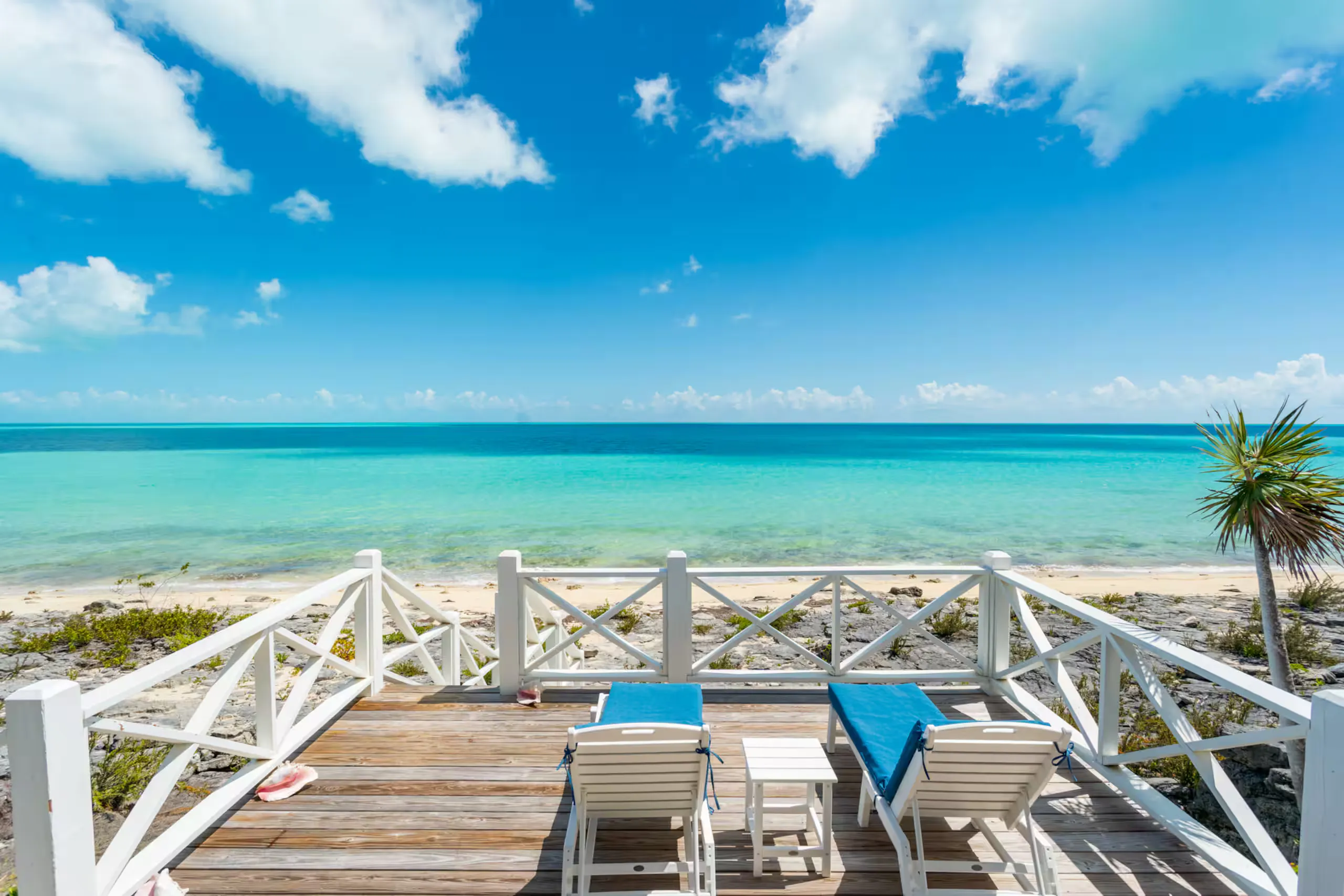 Deck loungers facing the open ocean