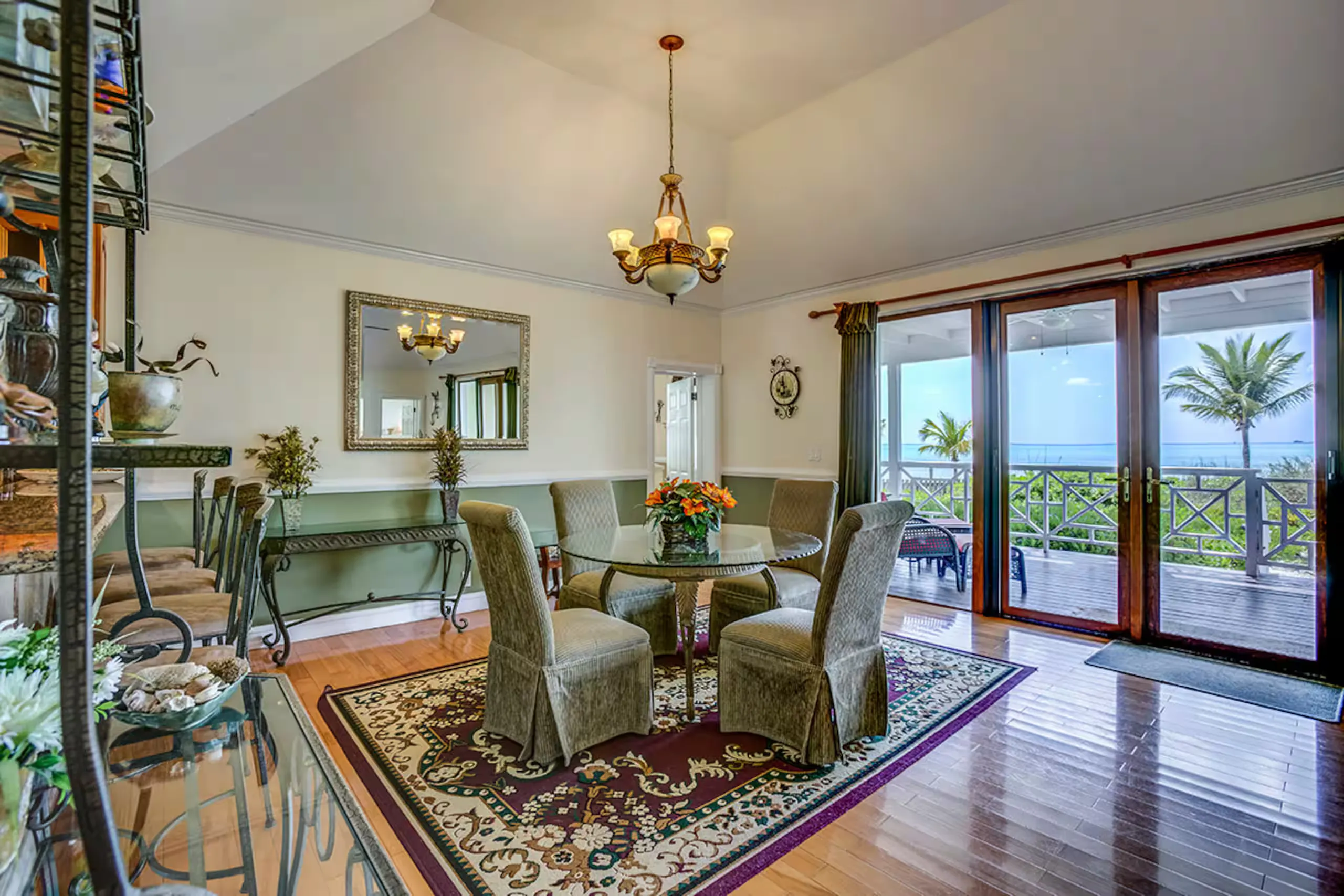 Dining nook with an ocean view through the balcony doors