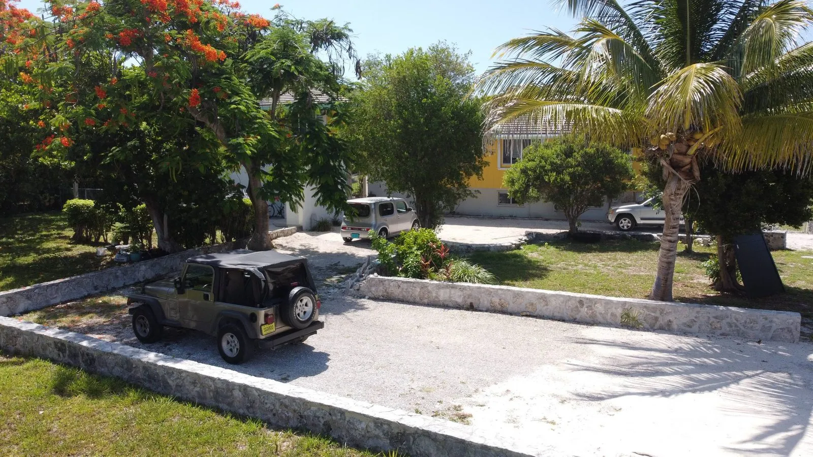The driveway with the on-site rental jeep parked