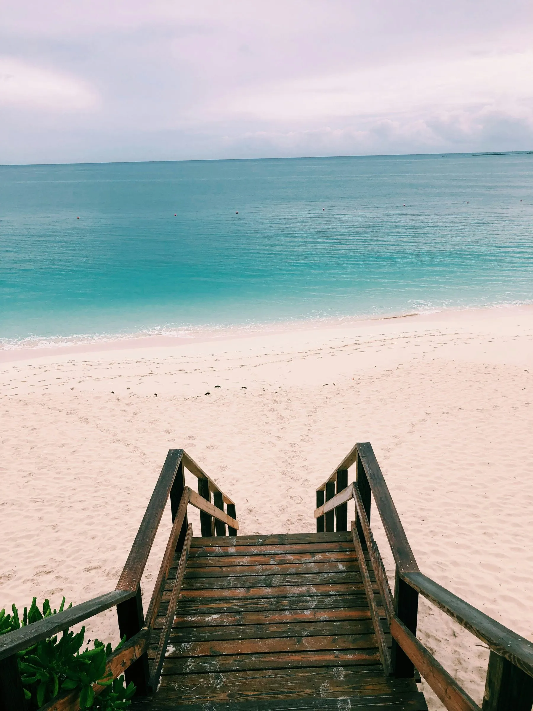 Wooden steps down to a quiet Nassau beach