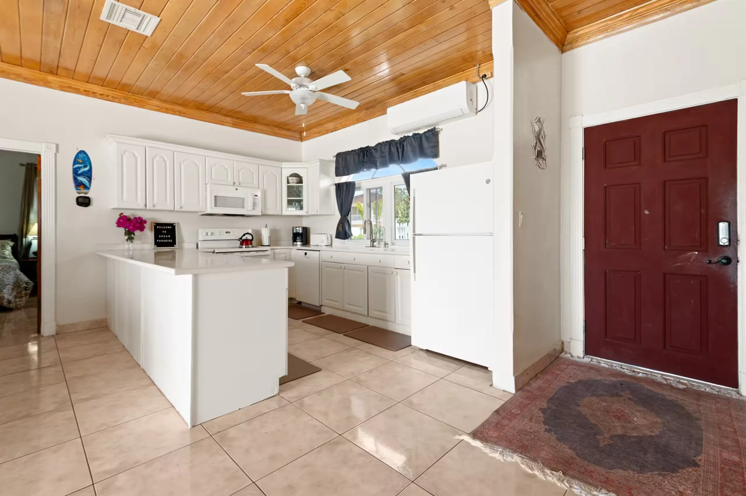 Kitchen with white cabinetry and a breakfast bar