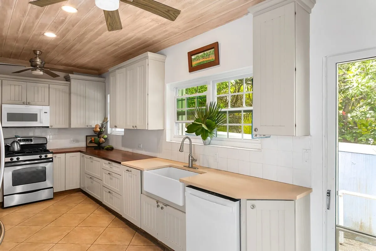Bright kitchen with cream cabinets and a farmhouse sink