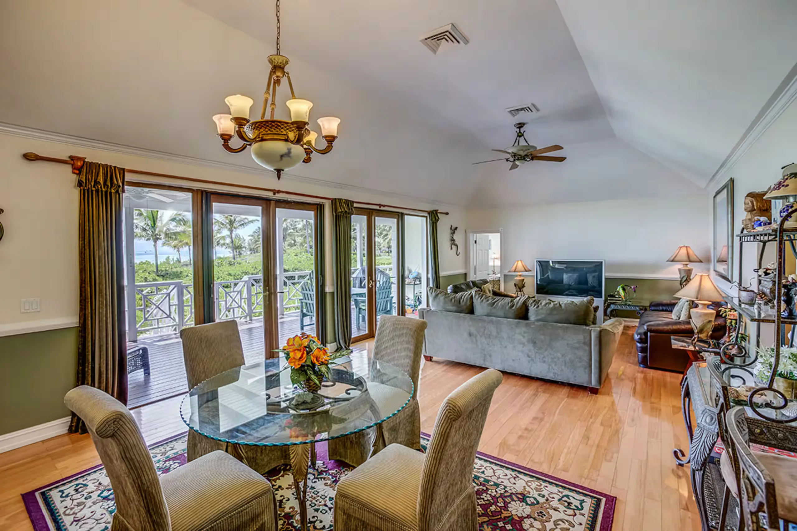 Living and dining room opening onto the ocean-view deck