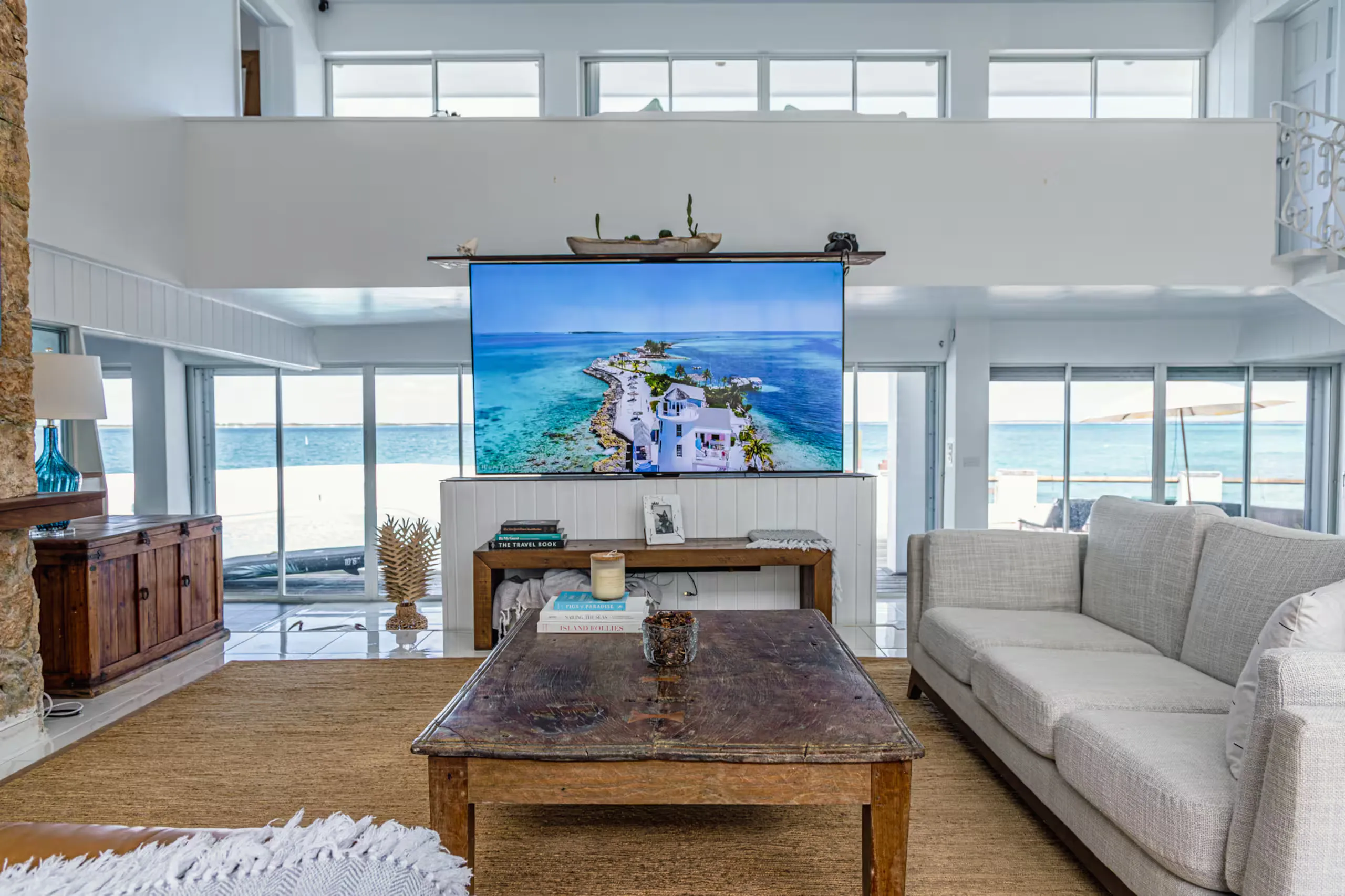 Living room with ocean views through floor-to-ceiling windows