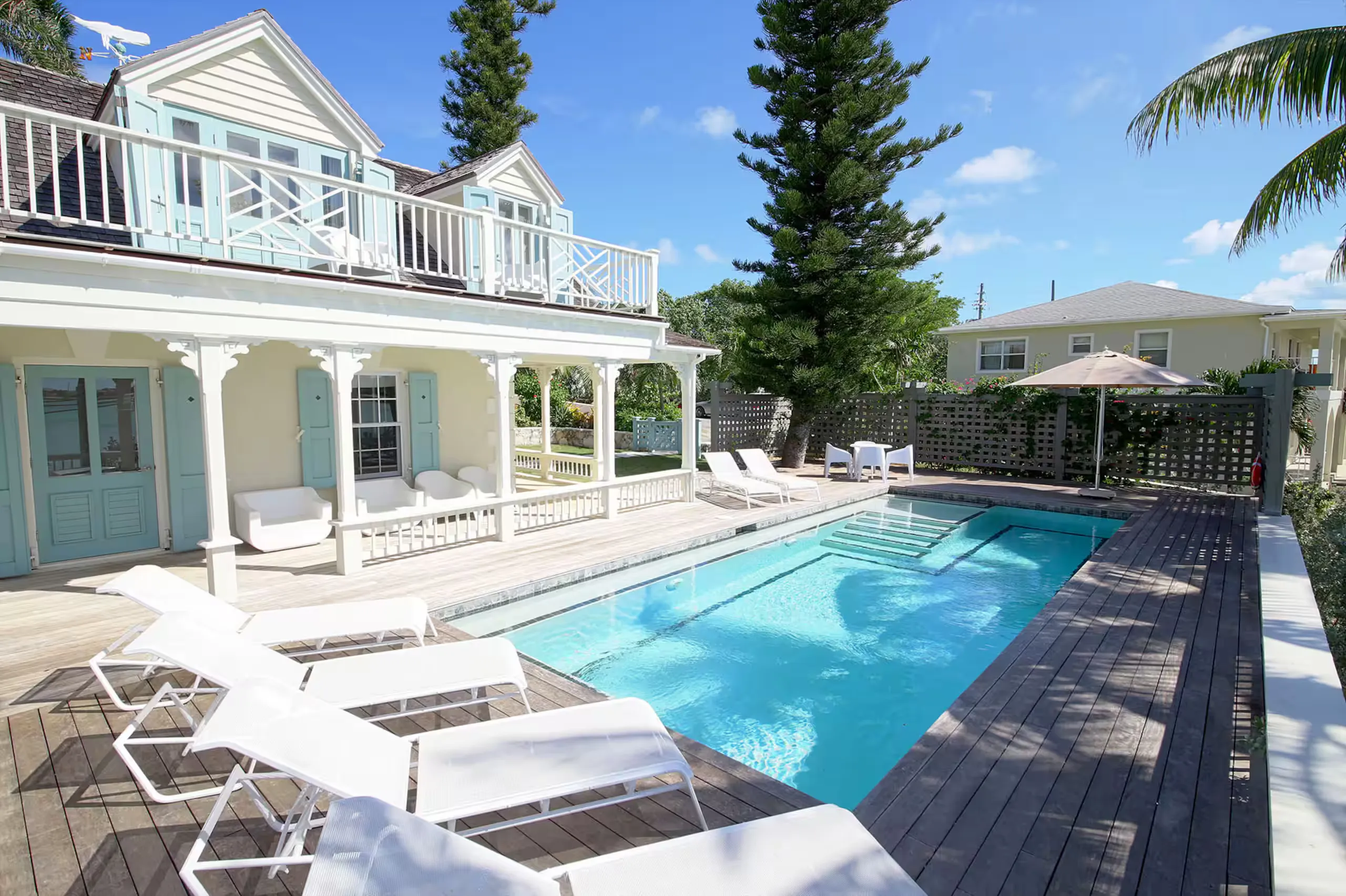 Pool and second-story balcony seen from the deck