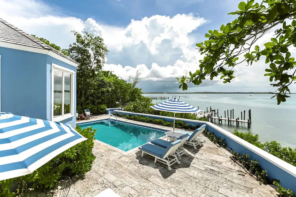 Saltwater pool and patio looking out to the private dock on the harbour