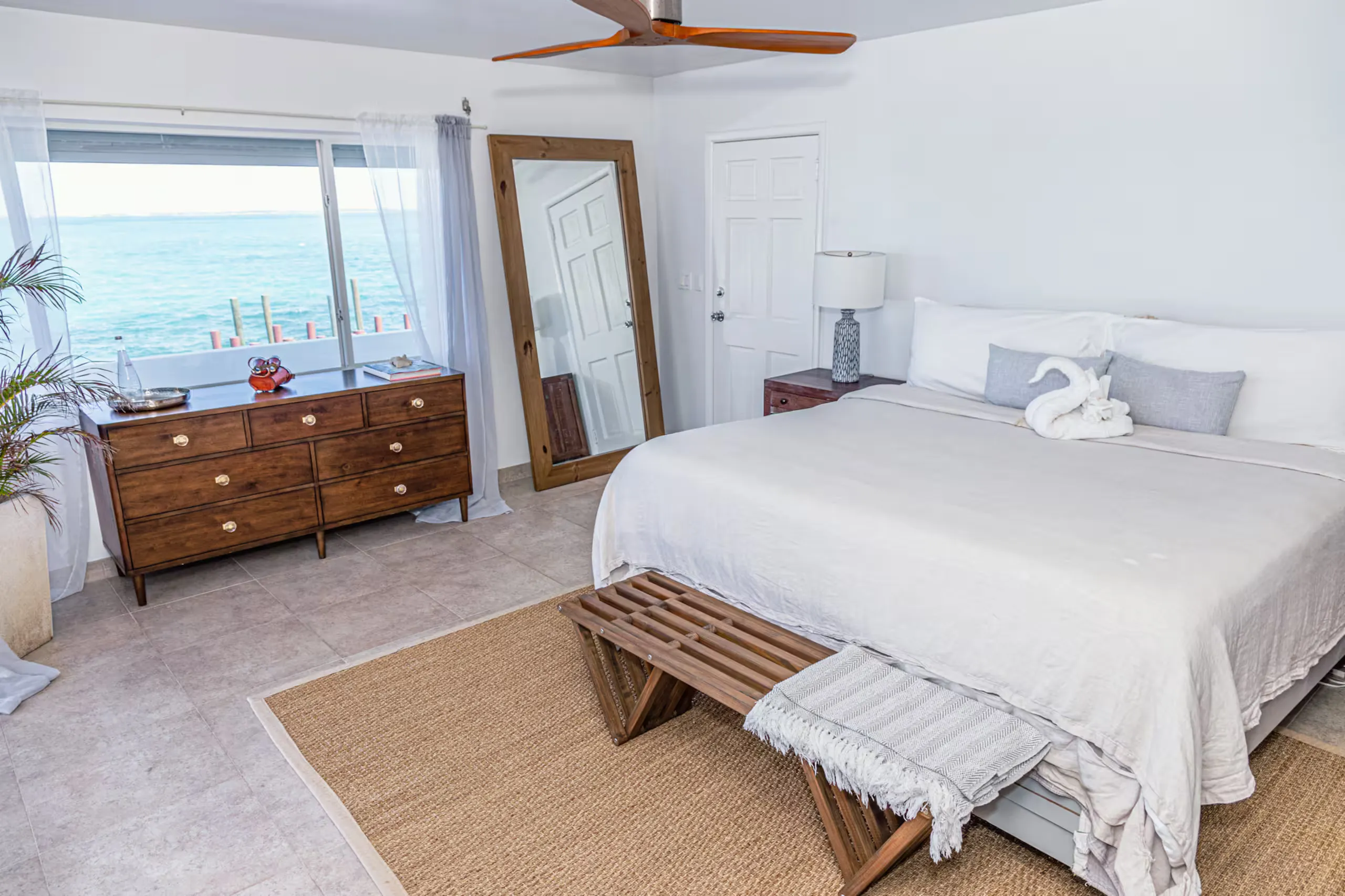 Primary bedroom with ocean-view windows