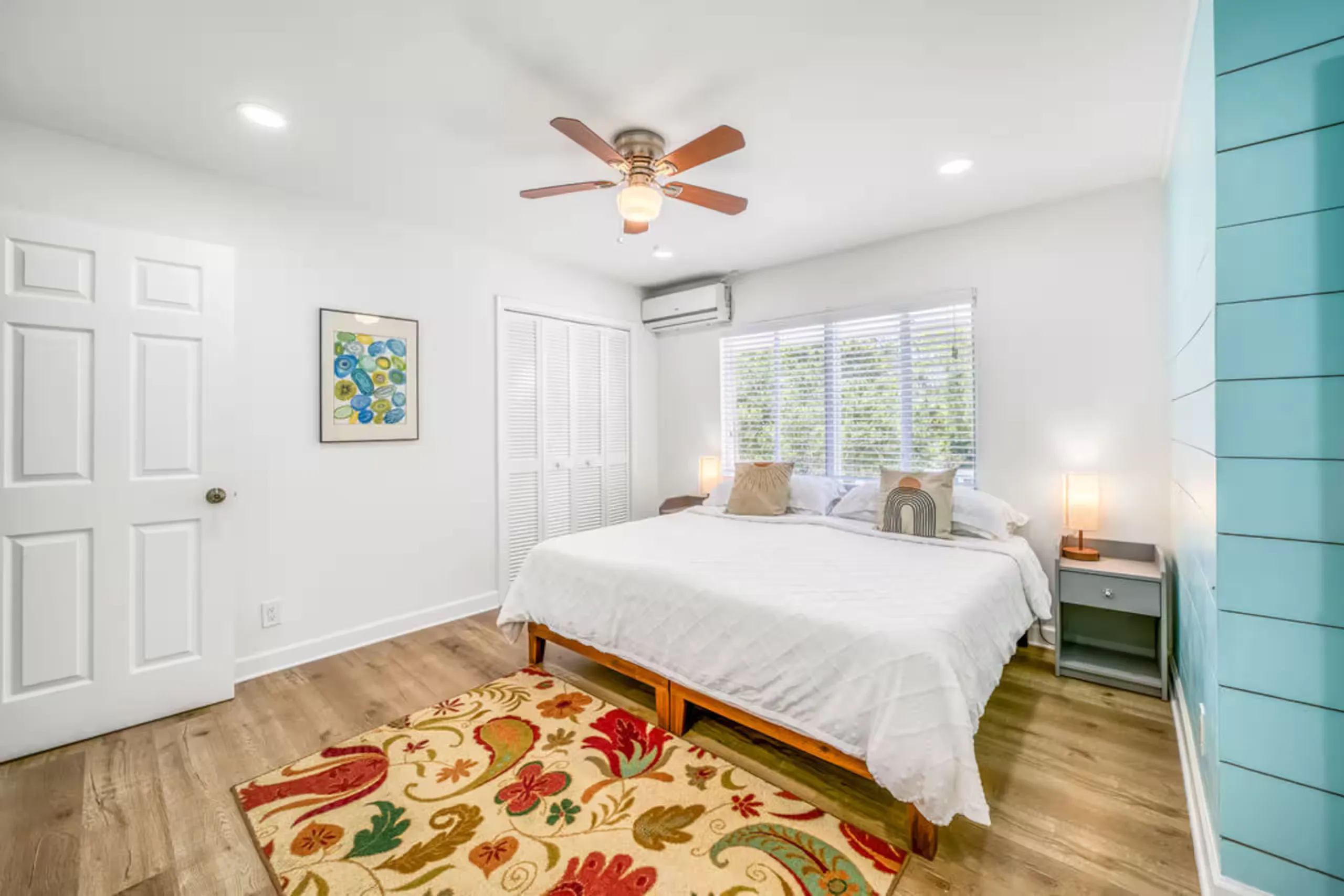 Primary bedroom with a king bed and floral rug