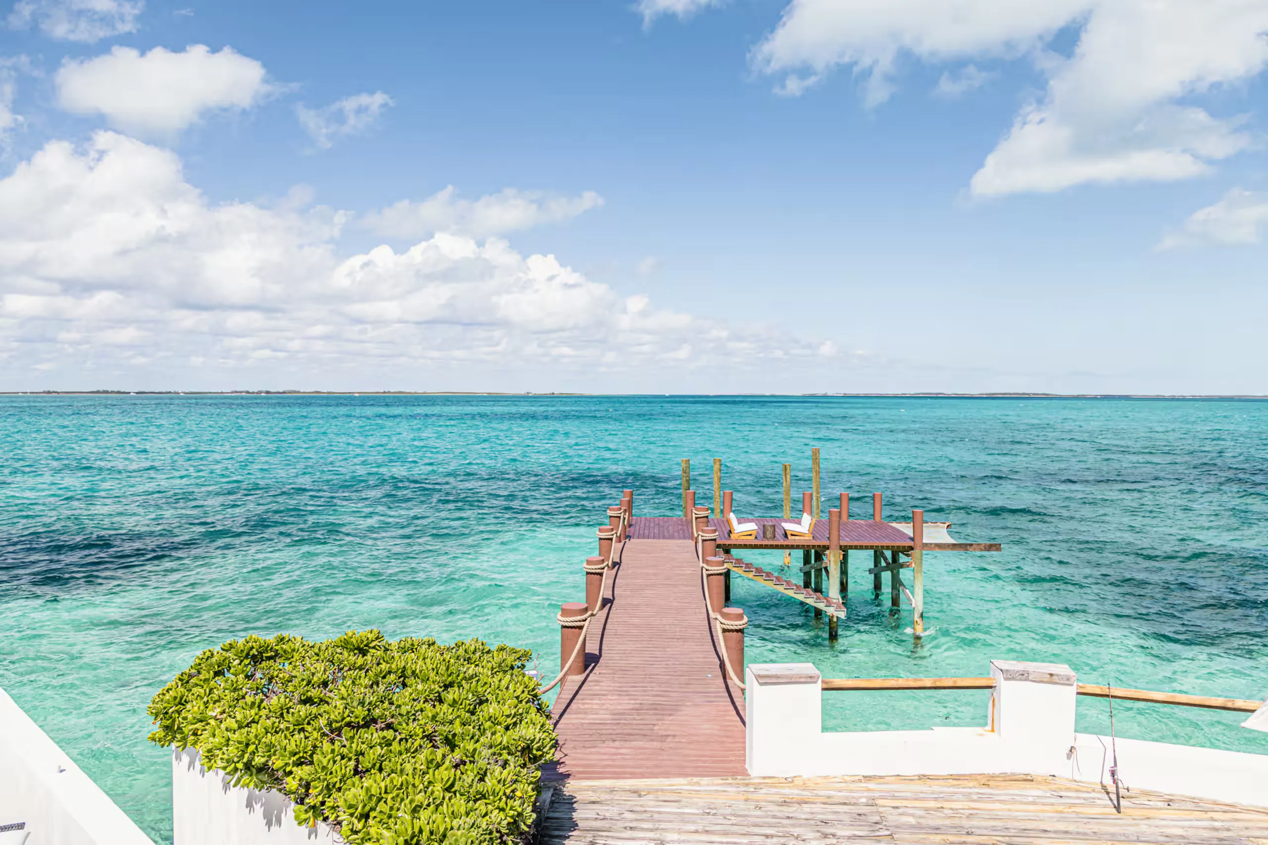 The villa's 90-foot private dock reaching into turquoise water