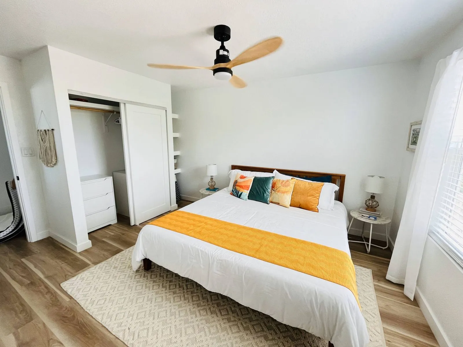 Second bedroom with a queen bed and built-in closet