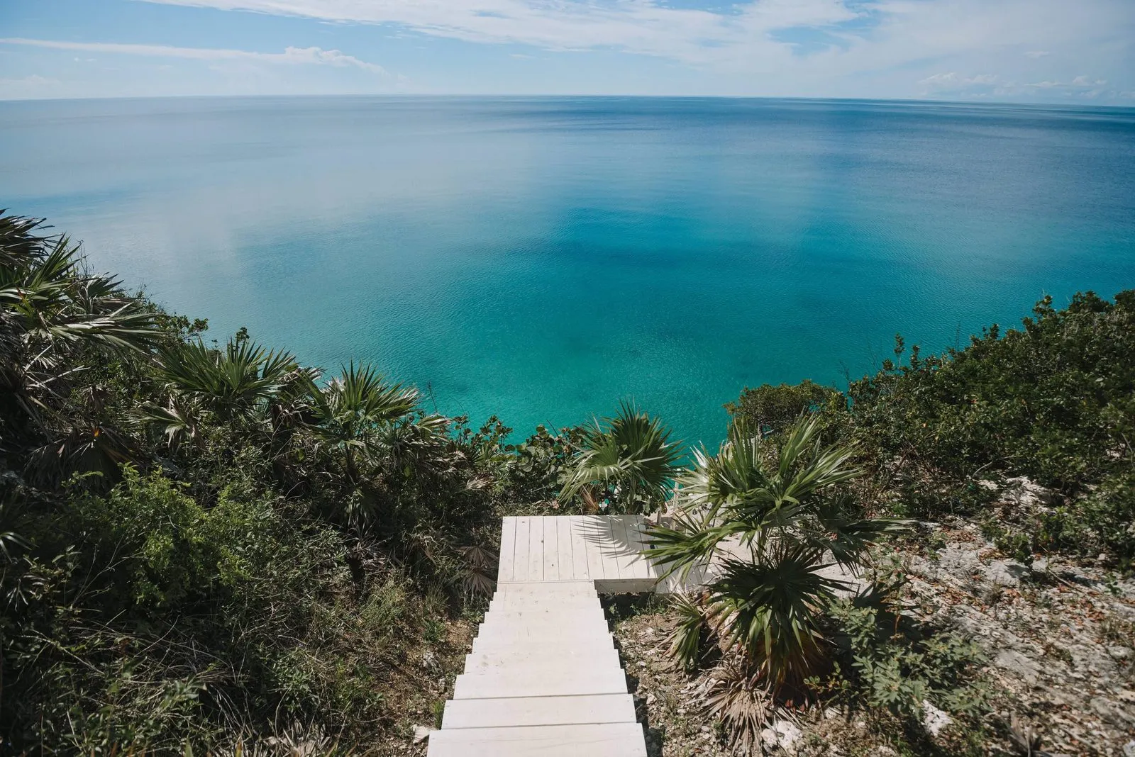 Wooden stairway leading down the cliff to the water