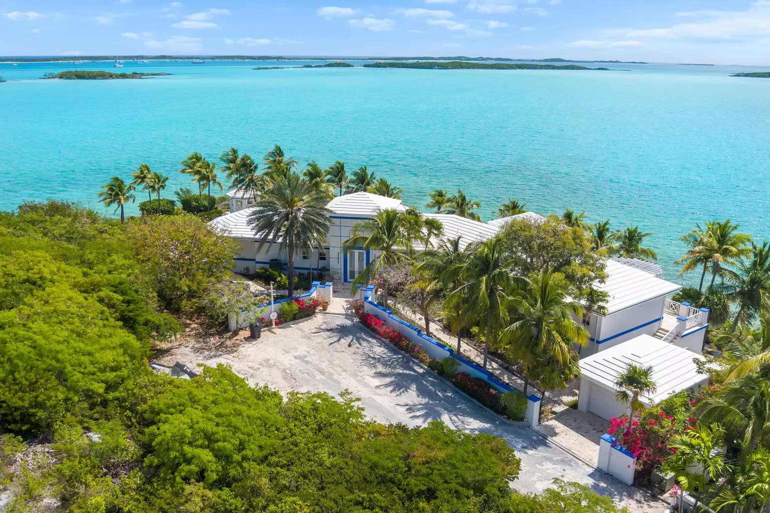 The villa at the water's edge, seen from the peninsula